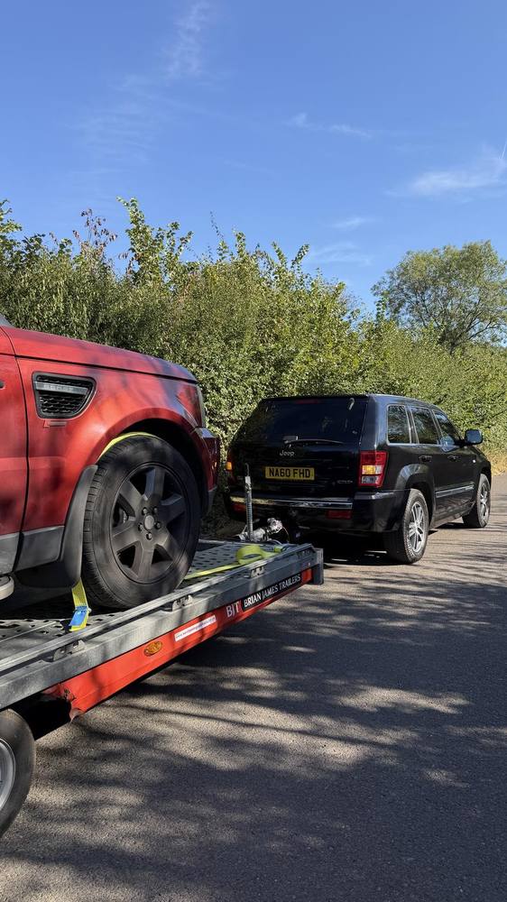 Loading a vehicle onto the open trailer