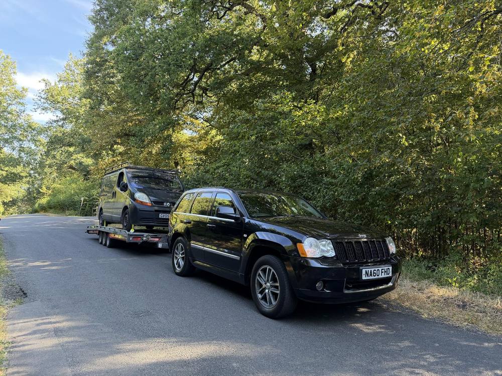 Jeep transported on the open trailer on a Sussex lane