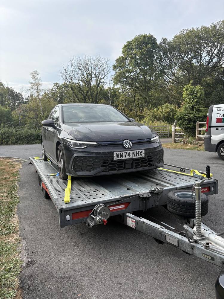 VW Golf loaded and strapped on the Brian James T6